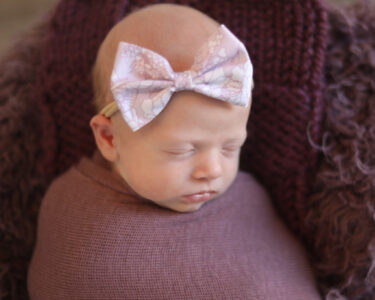 Sioux Falls Newborn posing in basket