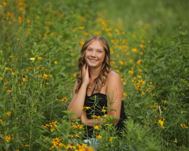 Sioux Falls Senior posing in Wildflowers