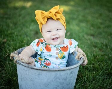 Sioux Falls Baby posing in bucket