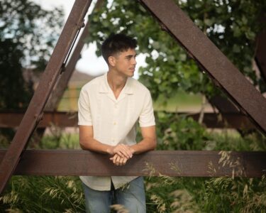 Sioux Falls Senior posing near bridge
