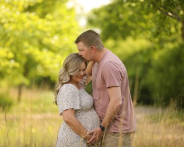 Sioux Falls Maternity Couple Posing in Field