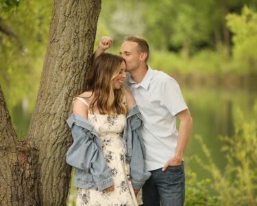 Sioux Falls Couple Posing next to tree