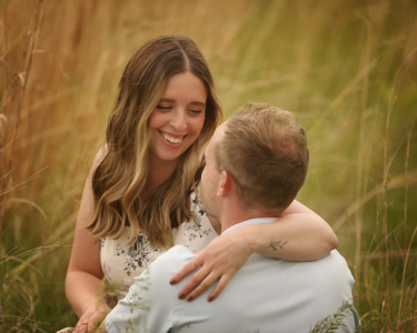 Sioux Falls Couple Laughing in Field
