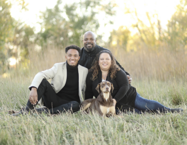 Sioux Falls family Posing in Tall Grass